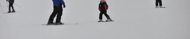 family skiing at Titus Mountain
