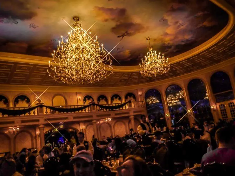 Be Our Guest ballroom with chandeliers and beautiful decor