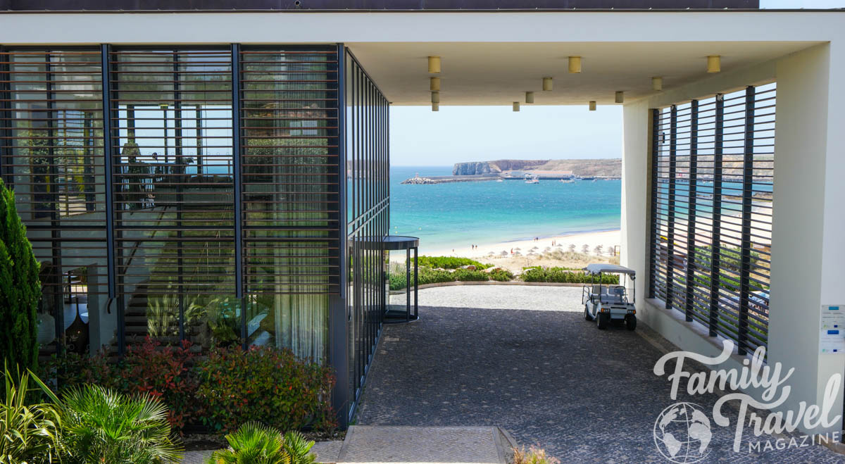 Martinhal main building with beach view through the opening. 