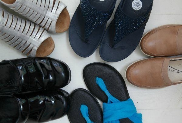 Selection of shoes including flip flops, sandals, and loafers.