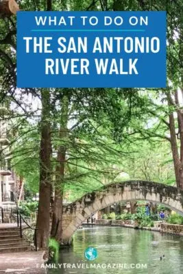 Pedestrian bridge over the river with trees overhead