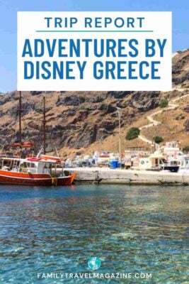 Boat docked at small colorful dock on rocky island