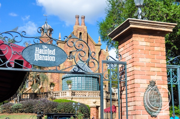 The Haunted Mansion gate with the mansion in the background