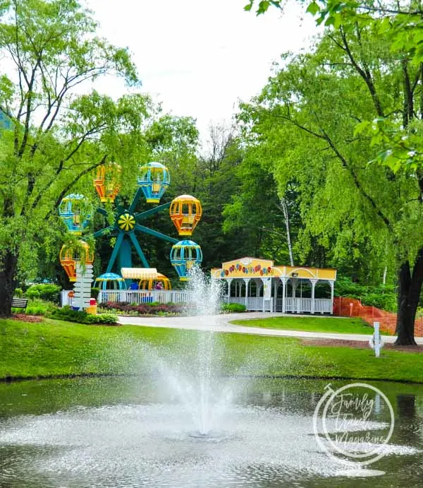 Story Land balloon ride ferris wheel ride with fountain in foreground