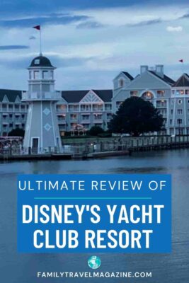 Disney Yacht Club with exterior and lighthouse in front of water.