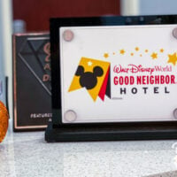 sign advertising Good Neighbor Hotel on counter