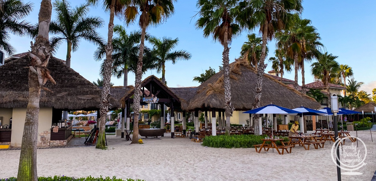 Barefoot by the Sea restaurant with tables and umbrellas