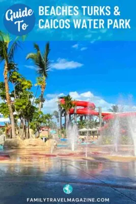 Water park with spray area and red waterslide