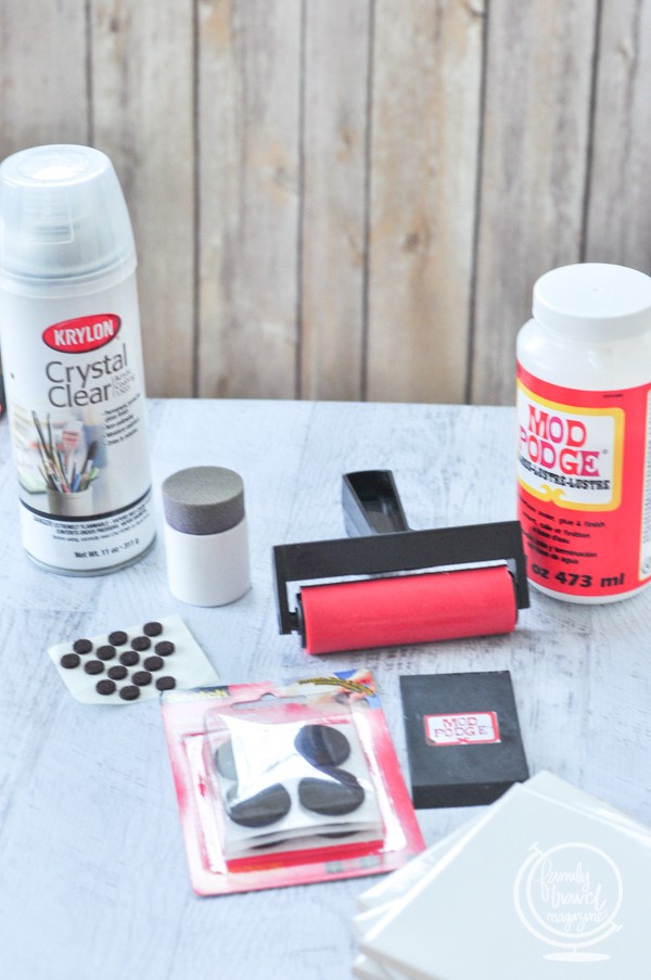 Materials including Mod Podge, roller, sponge, Crystal Clear Spray, and plain white coasters 