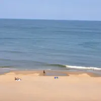Virginia Beach beachfront with a few people in the sand