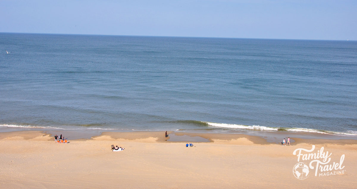 Virginia Beach beachfront with a few people in the sand