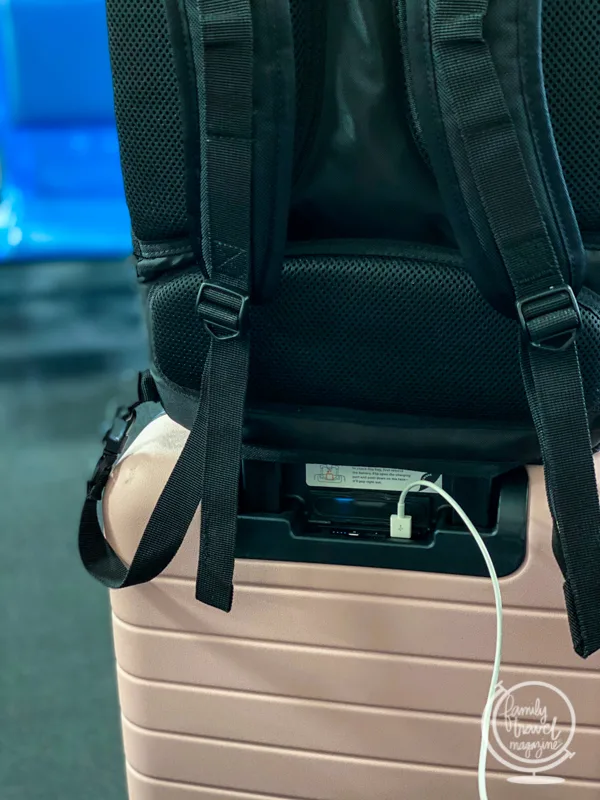 The included charger on an Away bag