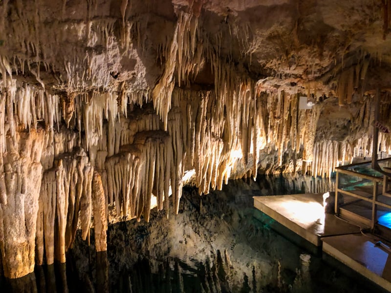 Crystal Cave Bermuda with formations over water and small view of walking platform