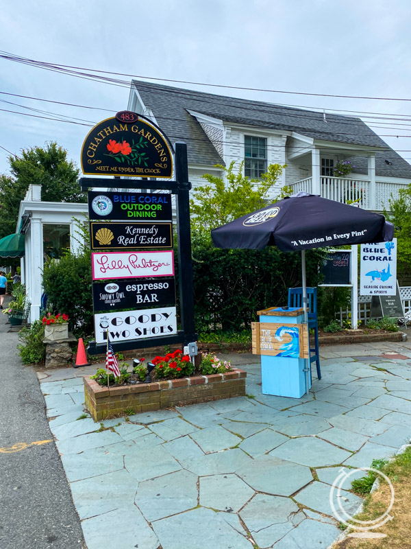 Sign for shops in Chatham MA including Lily Pulitzer and Blue Coral