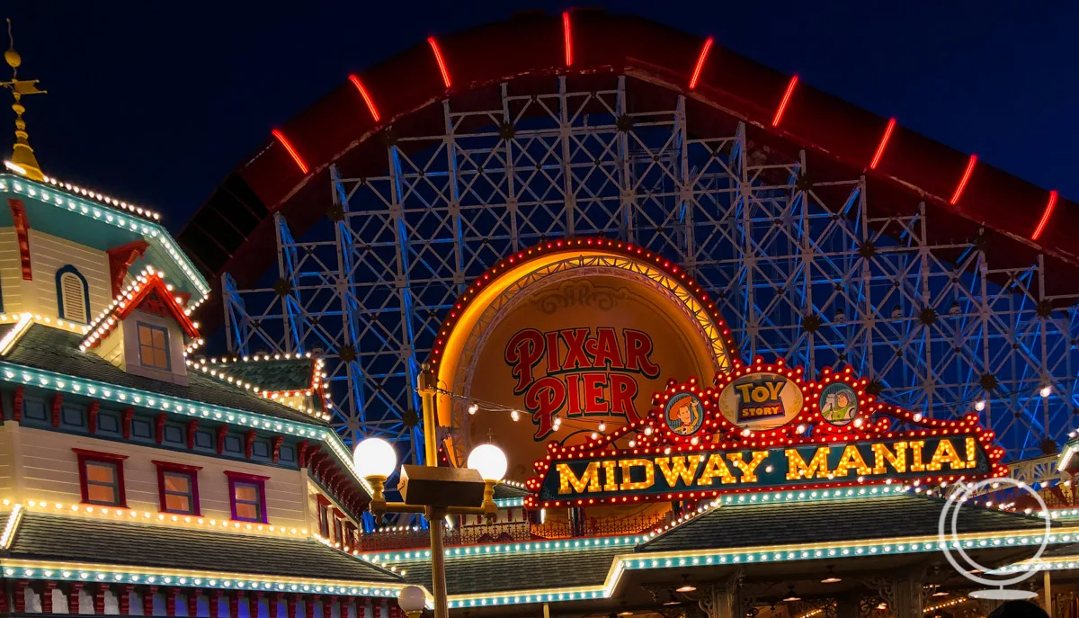 Pixar Pier at night with the Incredicoaster and Toy Story Midway Mania - two of the best rides at Disney's California Adventure. 