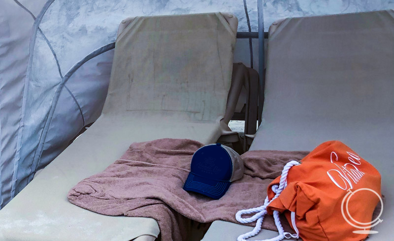 Beach chairs with towel, bag and hat 
