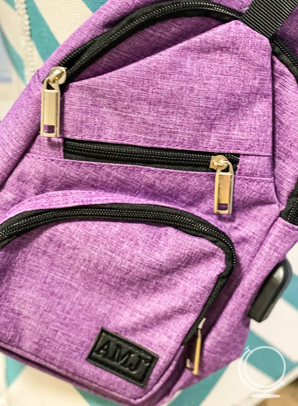 Purple sling bag with zippers - one of the best sling bags for travel