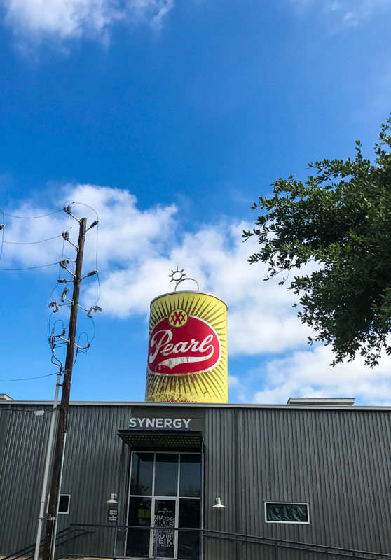 Pearl brewing can statue on top of building