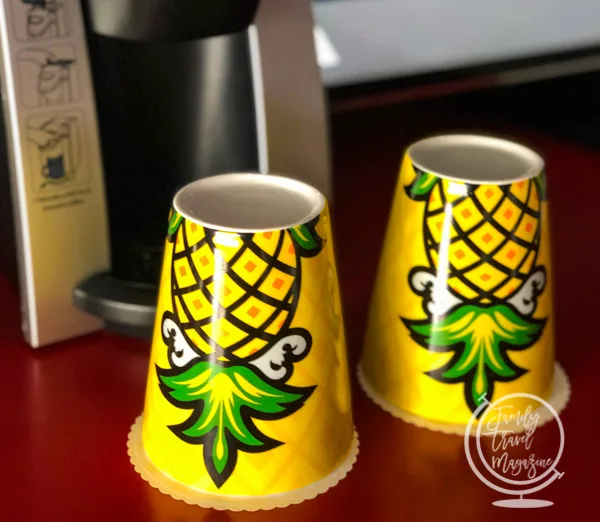 Yellow pineapple cups in front of coffee maker
