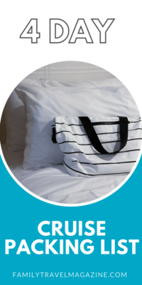 Photo of white and black striped tote bag on a white bed. 