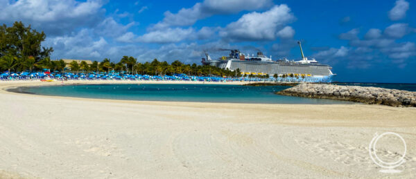 Odyssey of the Seas docked at CocoCay with the beach in the front