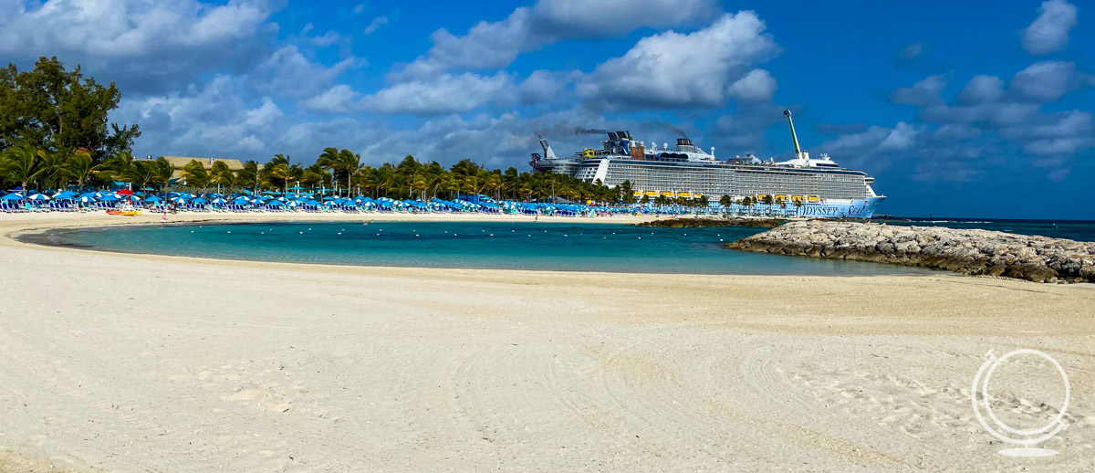 Odyssey of the Seas docked at CocoCay with the beach in the front (Royal Caribbean vs. Disney Cruise)