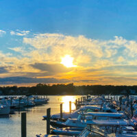 Bass River with boats docked at sunset