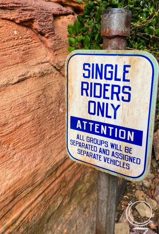 Sign showing that single riders will be separated and assigned separate vehicles