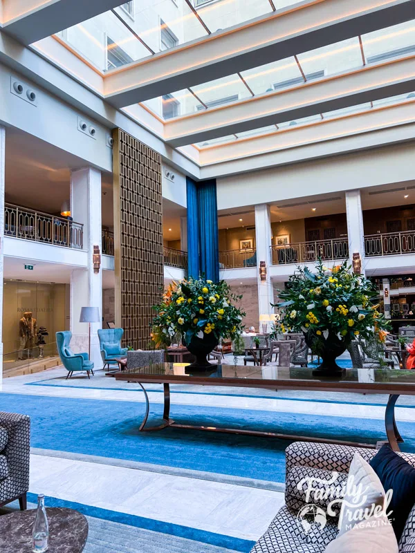 indoor lobby with flower displays, table, seatting