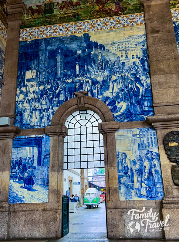 Blue and white tiles in a mural, with colorful tiles above. 