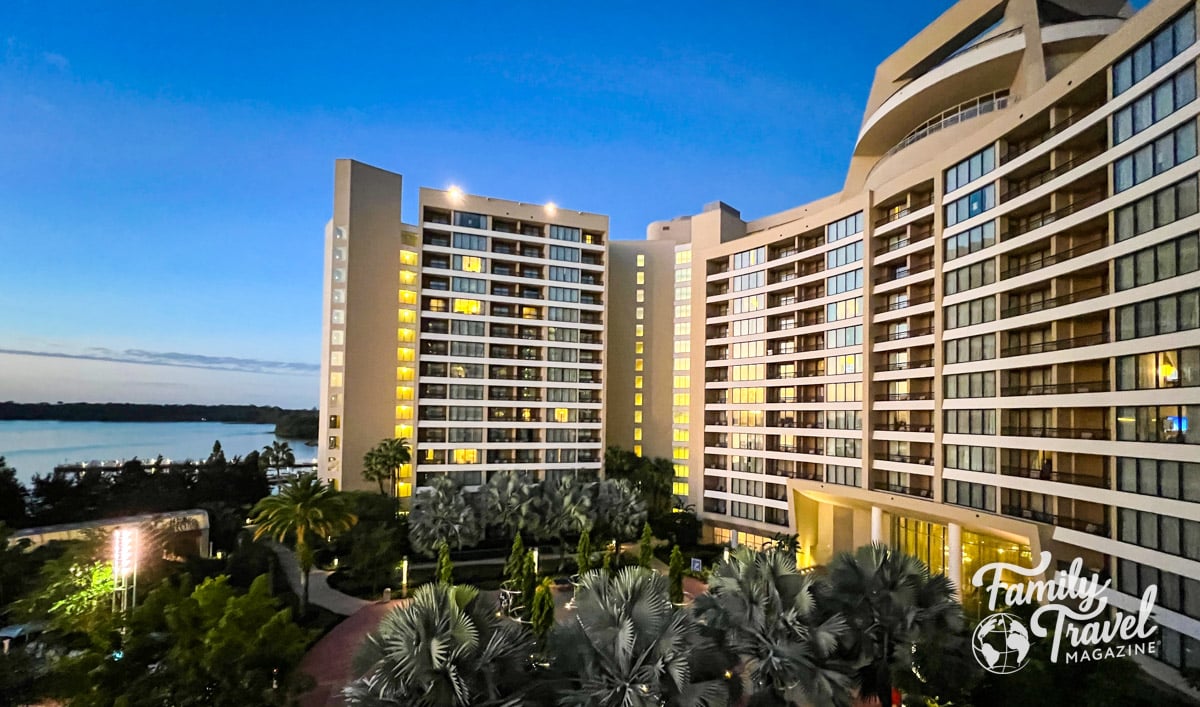 Bay Lake Tower exterior from one of the guest rooms with palm trees below. 