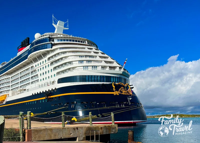 Disney Wish docked with blue sky and cloud 