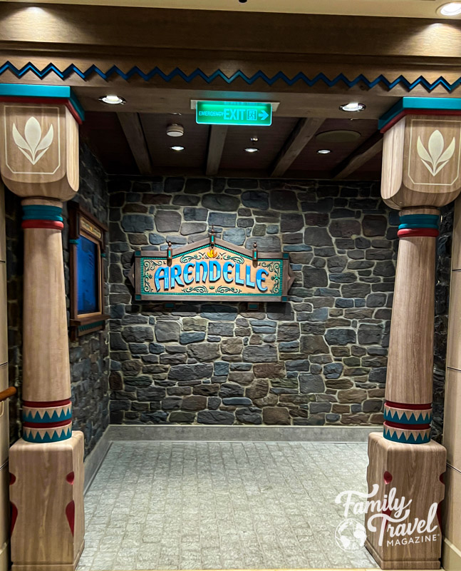 Entrance to Arendelle Restaurant with stone wall and wooden pillars