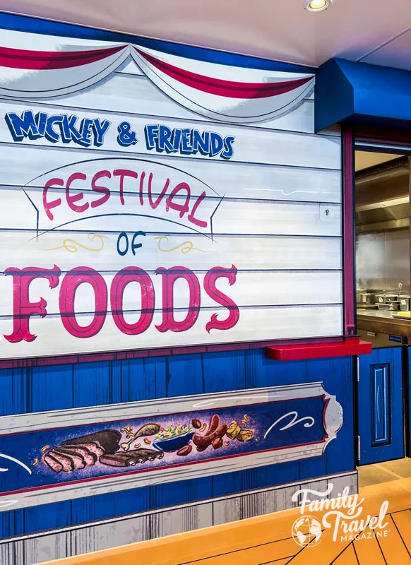Mickey and Friends Festival of Foods sign on the side of a kiosk 