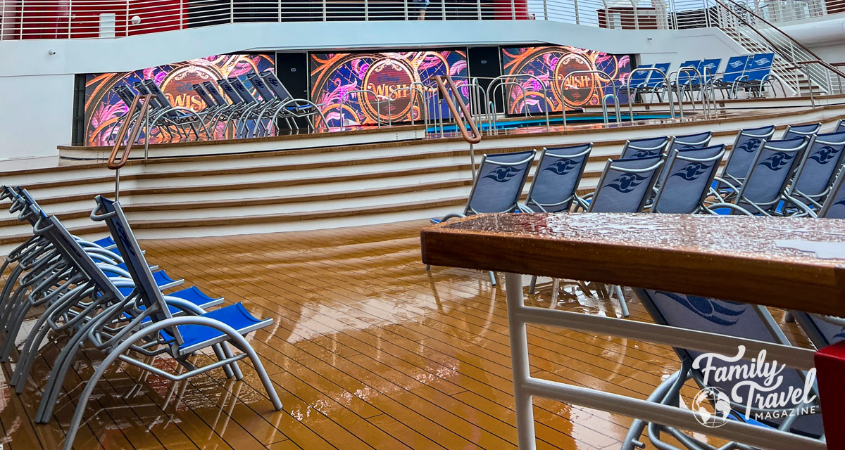 wet pool deck with deck chairs on cruise ship