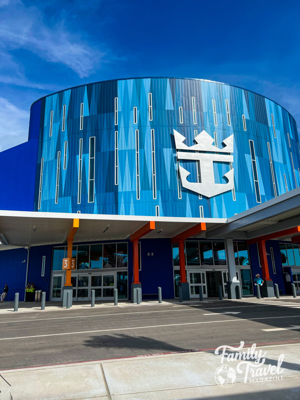Exterior of the Royal Caribbean terminal in Galveston with large crown and anchor logo
