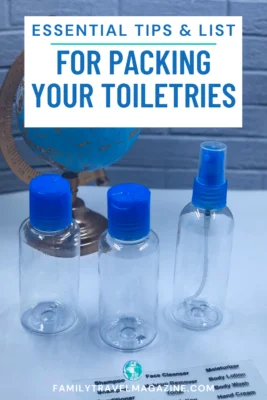 Empty toiletry bottles in front of mini globe with labels in the front. 