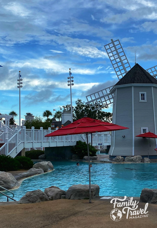 Windmill and pool with pedestrian bridge over it at Stormalong Bay