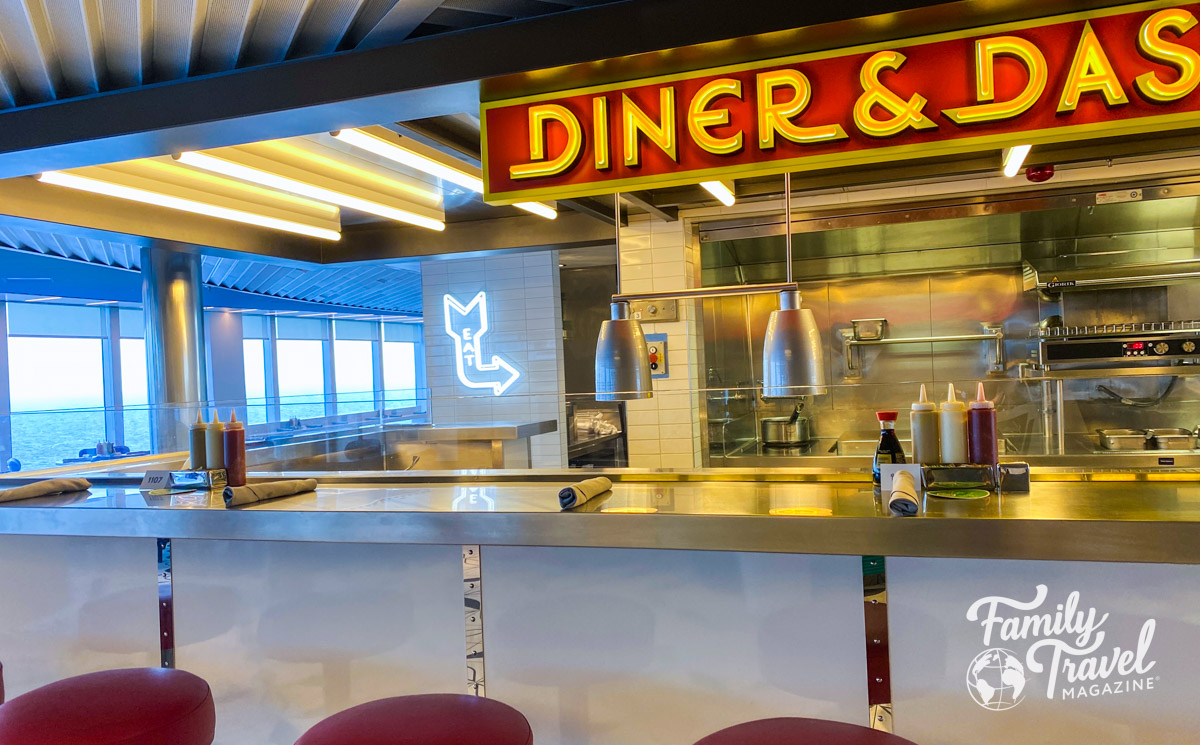 Diner and Dash counter with grill and counter stools - one of the Virgin Voyages restaurants