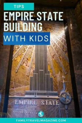 Brown sign advertising Empire State Building with raised image of the building