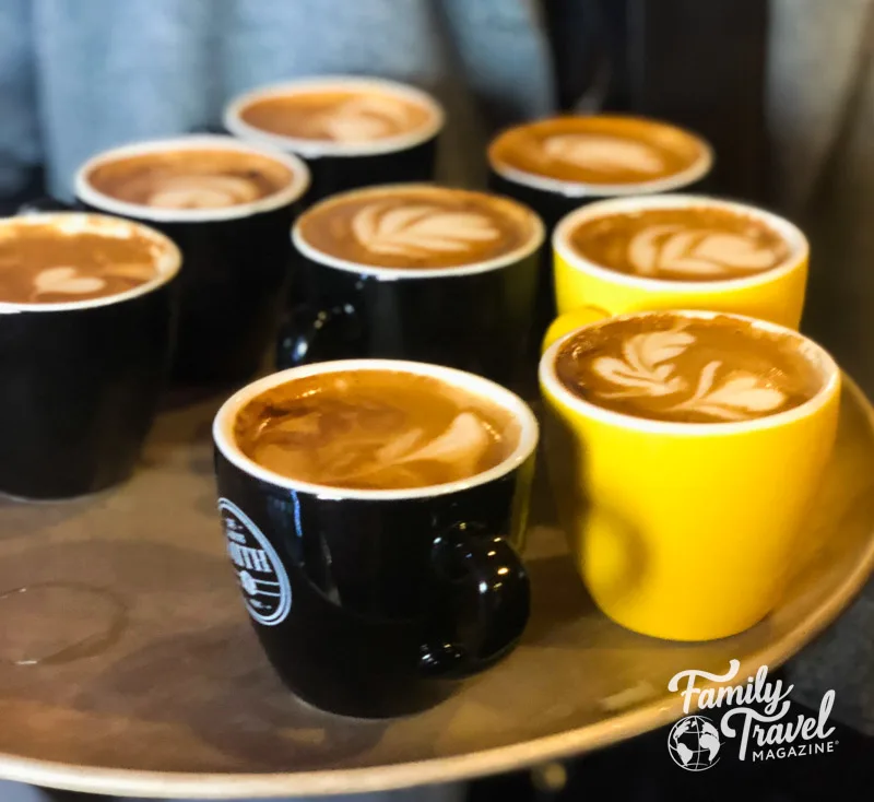 Tray with coffees with designs on the top