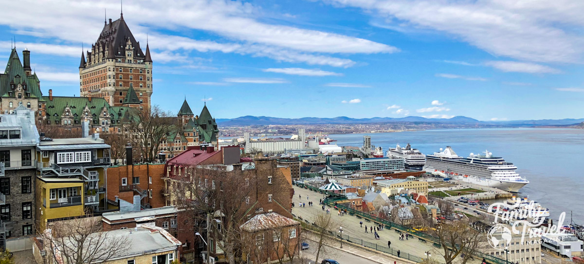 View of river with old buildings, Chateau Frontenac, and boardwalk
