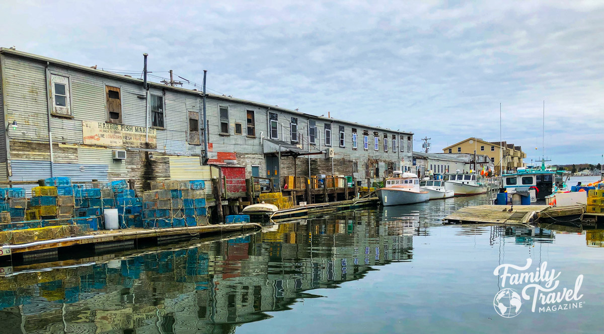 The waterfront in Portland, with fish market buildings and fishing boats. One of the best ideas for a New England family vacation.