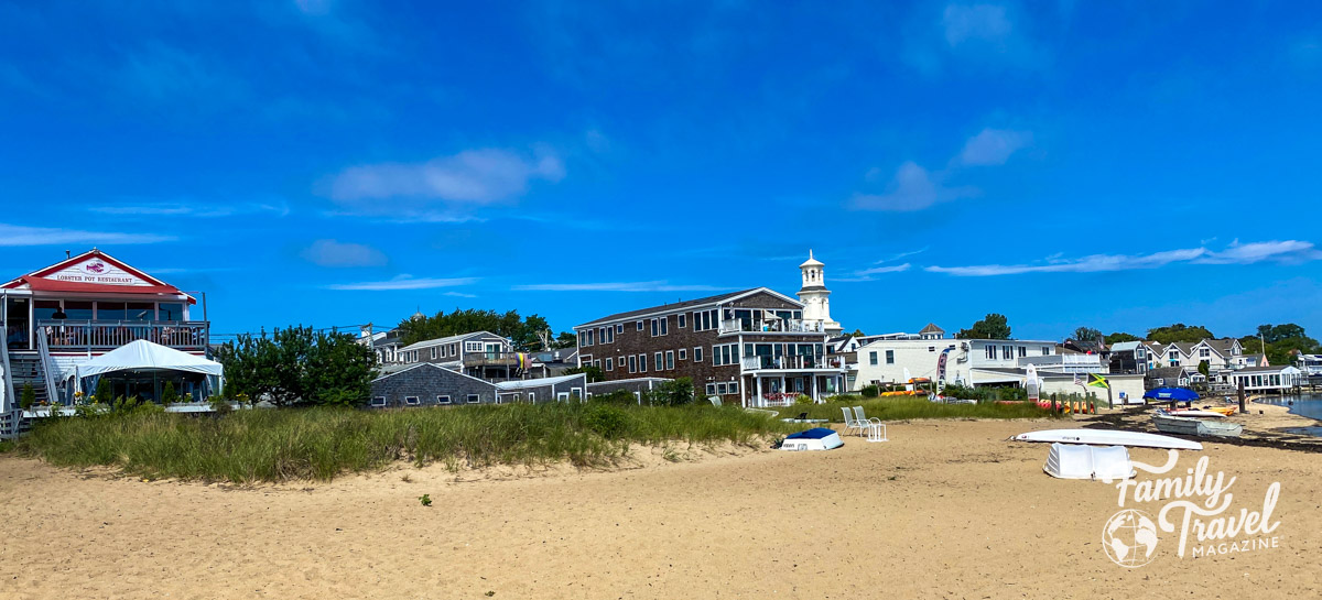 Provincetown shops and restaurants from the back with sand in the foreground - some of the best things to do in Provincetown. 