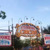 Entrance to Storybook Circus (home to many Magic Kingdom rides with toddlers) with signs and banners advertising the entrance.