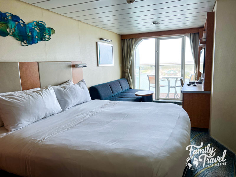 Stateroom with king bed and couch