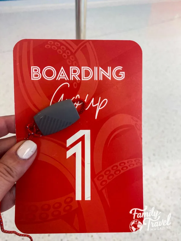 Boarding group card with wearable bracelet