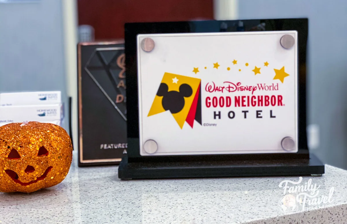 sign advertising Disney Good Neighbor Hotels on counter