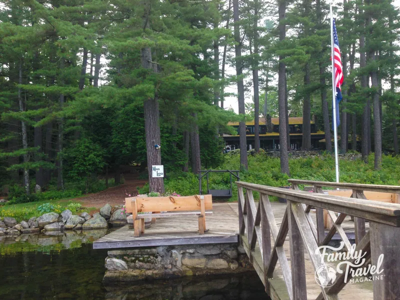 Migis Lodge from the lake with pier and bench