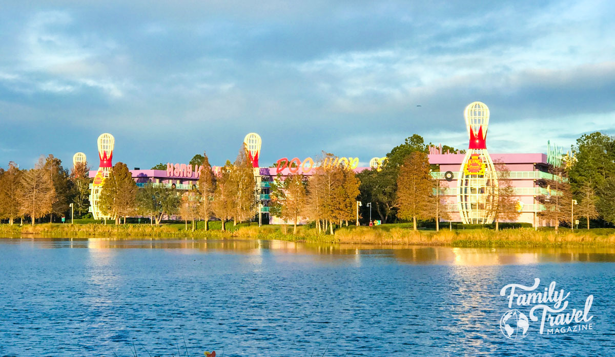 hotel on water with large decorative bowling pins on the outside at Pop Century, one of Disney's Value Resorts. 